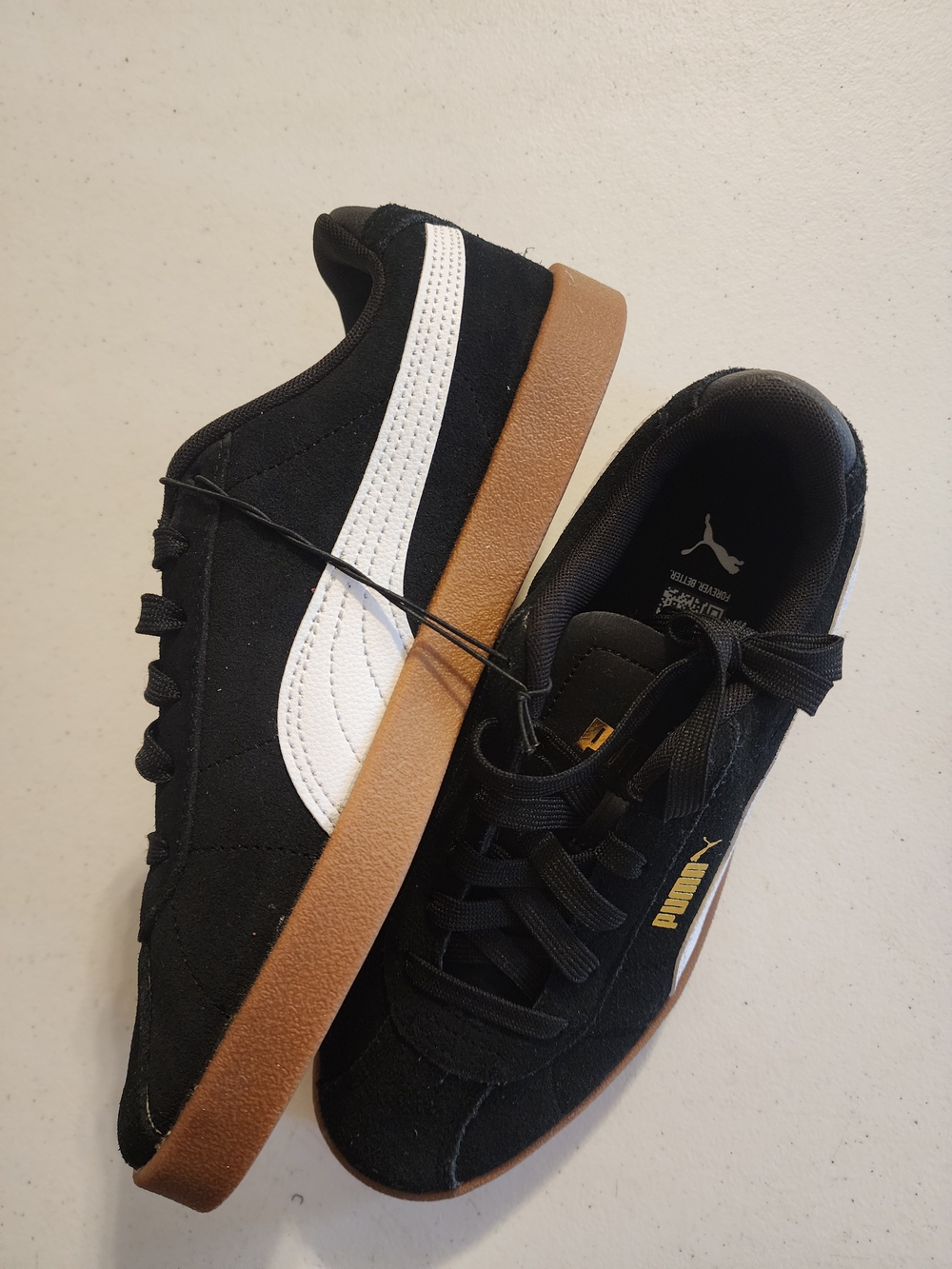 Puma Women's Black Suede Sneakers with White Stripe and Gum Sole
